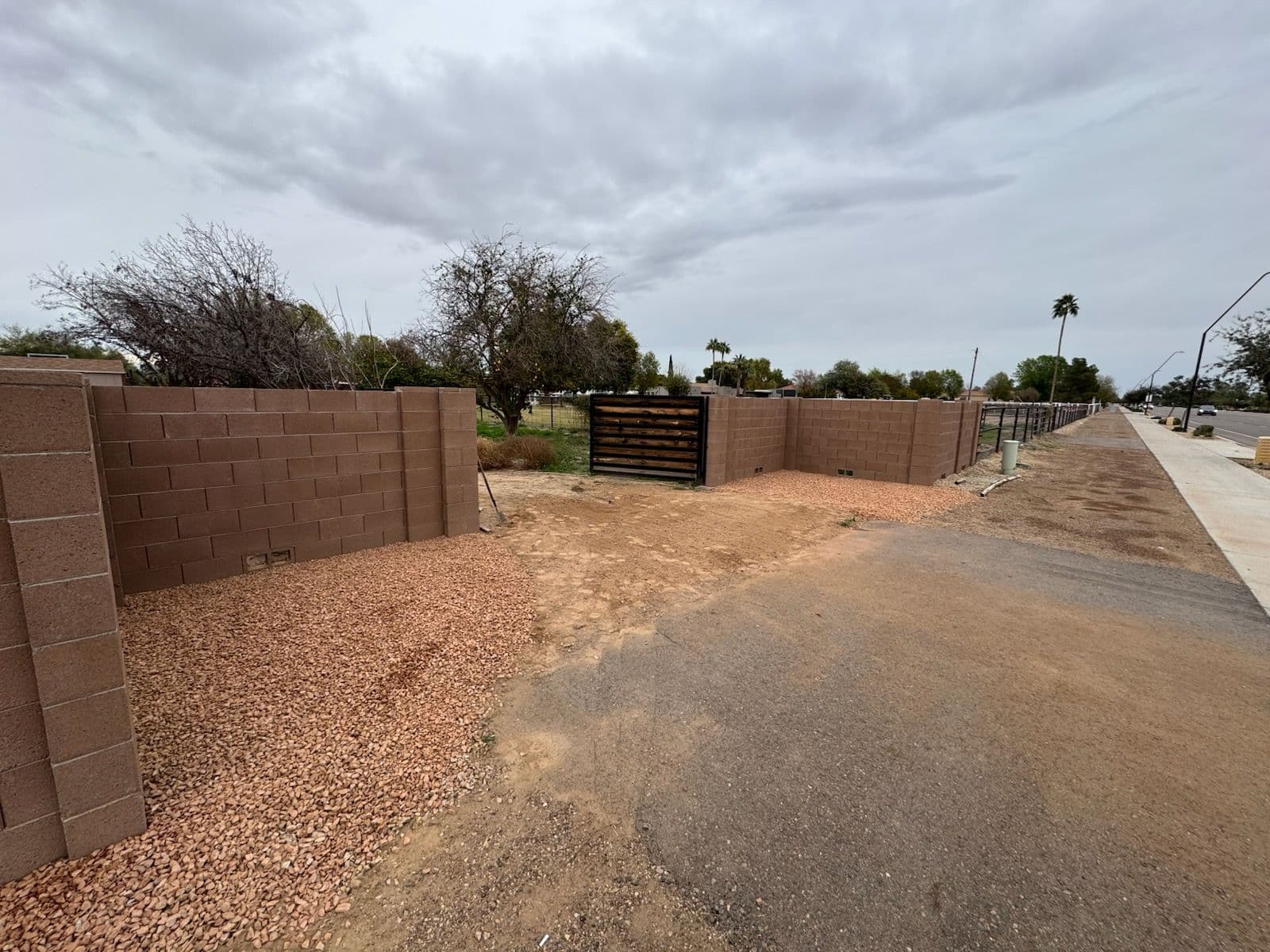 Sleek Rock Pathway to Elegant Metal Gate