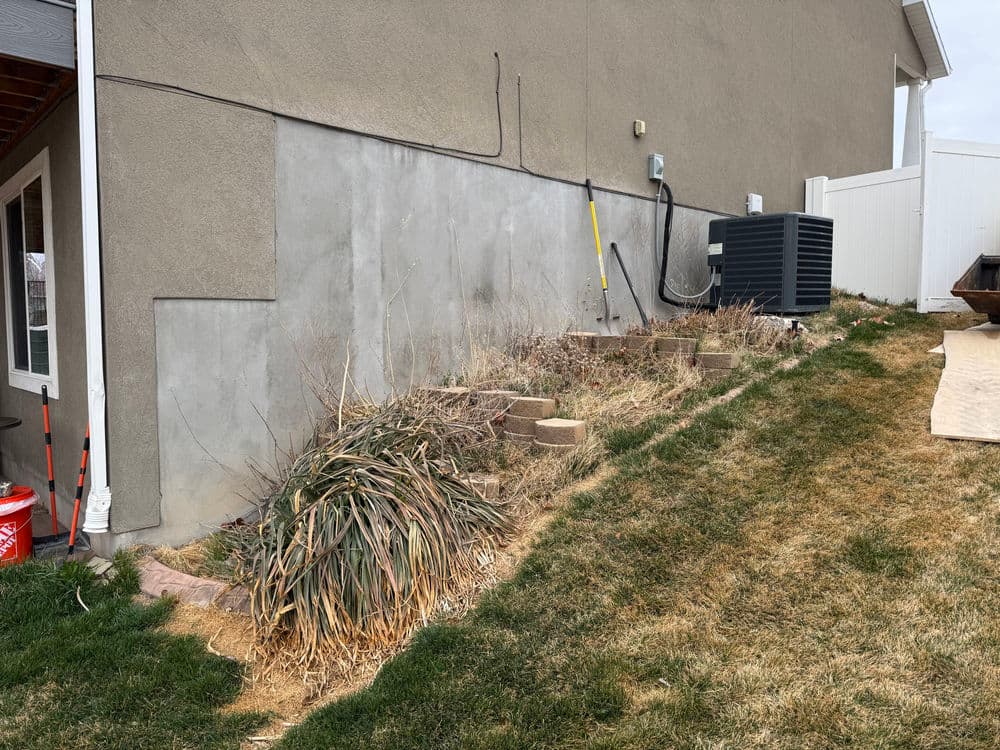 Gallery photos for Steep Grade Garden Bed Gets Retaining Wall Tiers and River Rock: Image #1