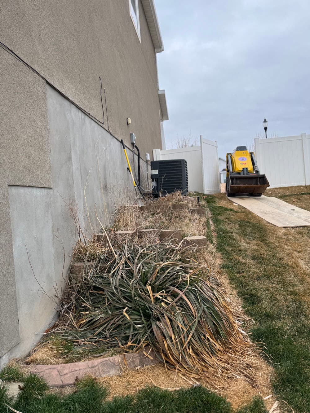 Gallery photos for Steep Grade Garden Bed Gets Retaining Wall Tiers and River Rock: Image #2