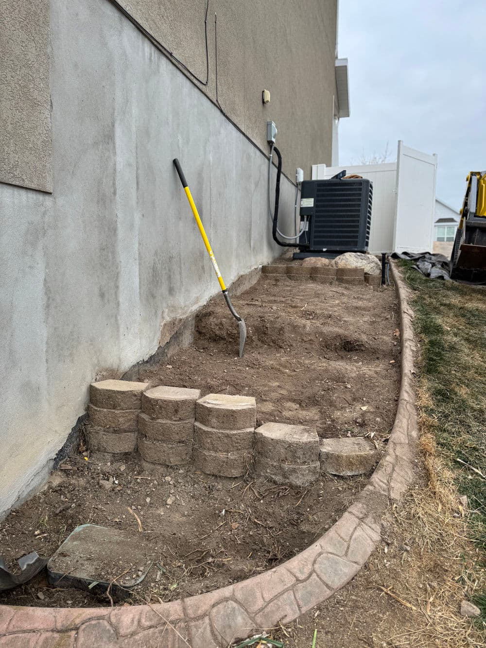 Gallery photos for Steep Grade Garden Bed Gets Retaining Wall Tiers and River Rock: Image #3