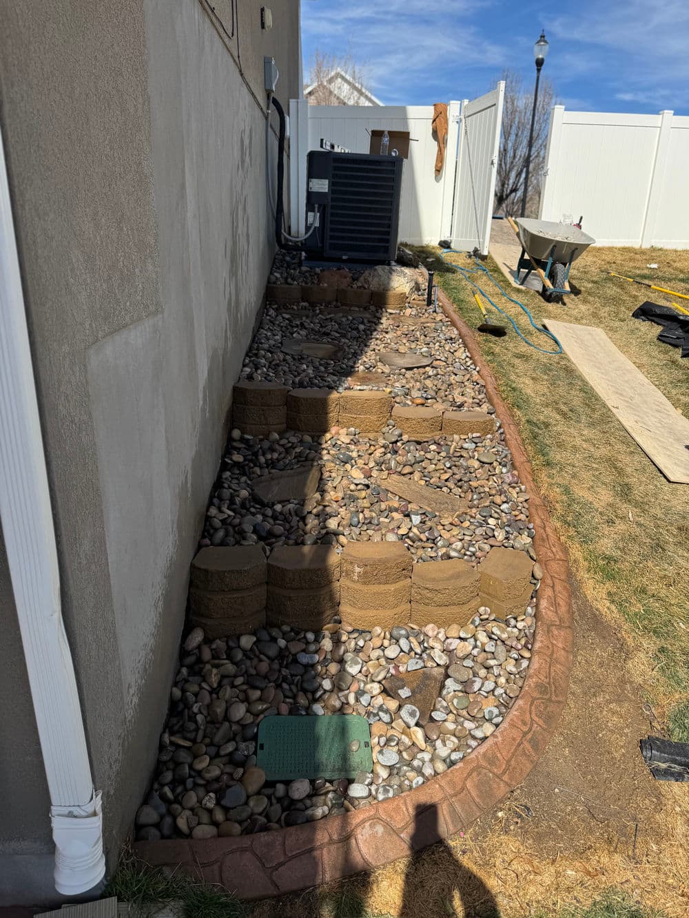 Gallery photos for Steep Grade Garden Bed Gets Retaining Wall Tiers and River Rock: Image #5