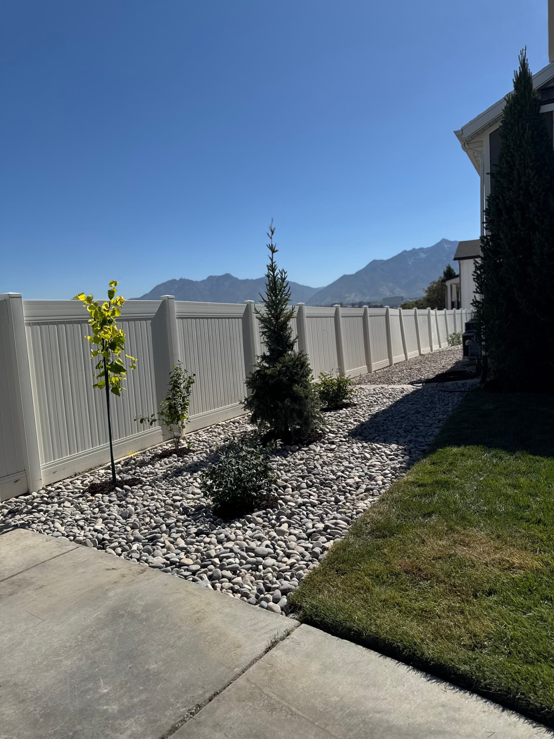 Gallery photos for Backyard Patio Expansion with River Rock and Garden Beds: Image #5