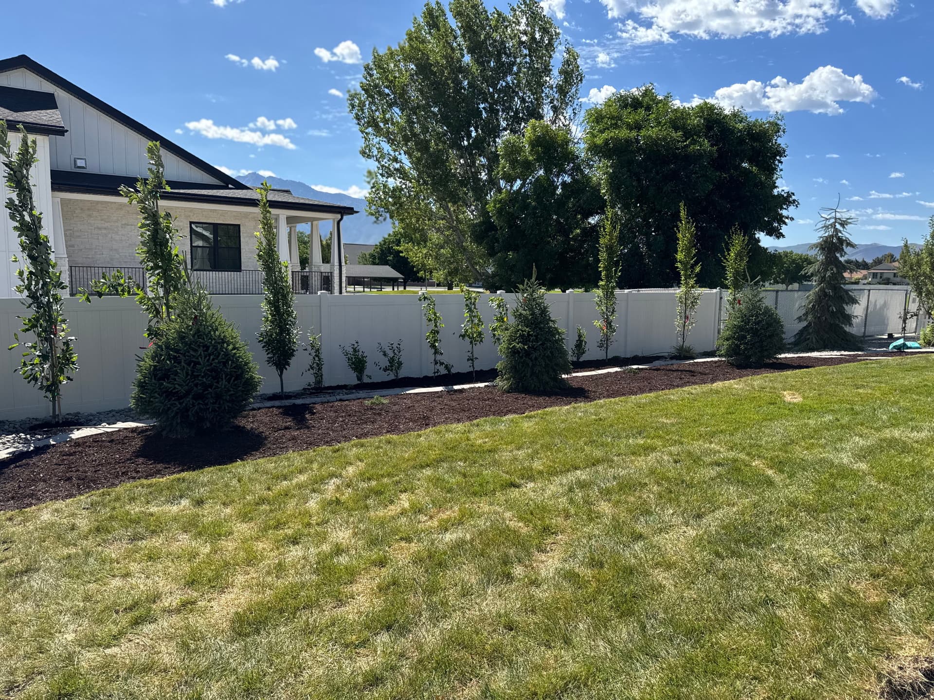Gallery photos for Backyard Patio Expansion with River Rock and Garden Beds: Image #4