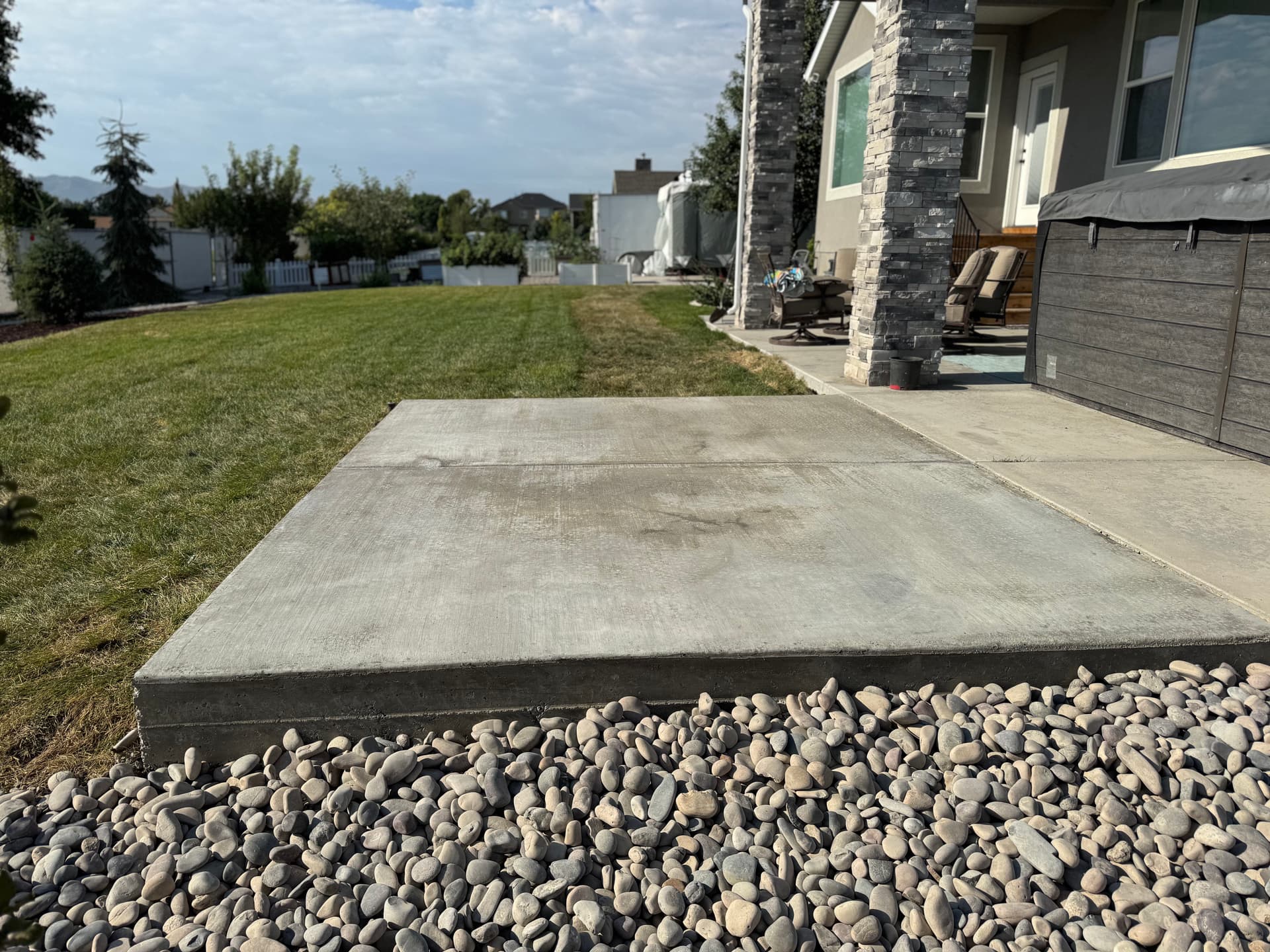 Gallery photos for Backyard Patio Expansion with River Rock and Garden Beds: Image #2