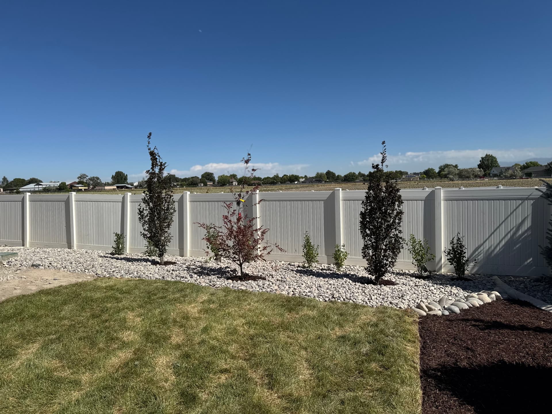 Gallery photos for Backyard Patio Expansion with River Rock and Garden Beds: Image #3